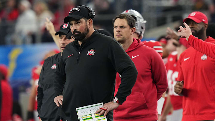Dec 29, 2023; Arlington, Texas, USA; Ohio State Buckeyes head coach Ryan Day watches during the