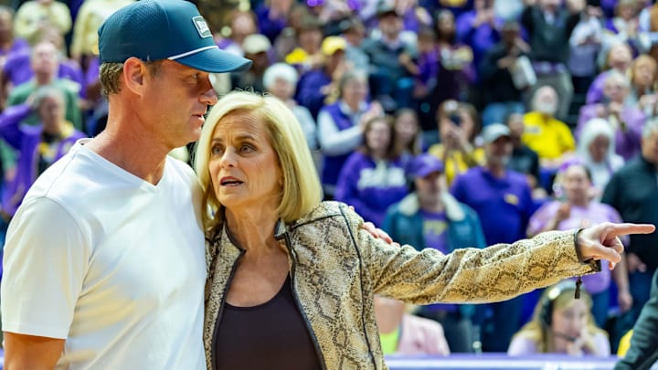 LSU Football Coach Lane Kiffin walks out with Tigers Basketball Coach Kim Mulkey, LSU Tigers Womens Basketball takes on the Kentucky Wildcats. Thursday, Jan. 1, 2026.