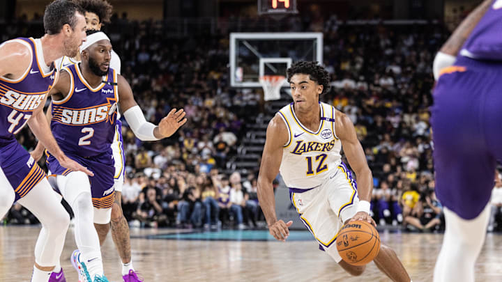 Oct 6, 2024; Palm Desert, California, USA; Los Angeles Lakers guard Max Christie (12) moves the ball against the Phoenix Suns during the second half  at Acrisure Arena. Mandatory Credit: David Frerker-Imagn Images