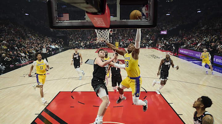 Feb 20, 2025; Portland, Oregon, USA; Los Angeles Lakers forward Rui Hachimura (28) scores a basket during the first half against Portland Trail Blazers center Donovan Clingan (23) at Moda Center. Mandatory Credit: Troy Wayrynen-Imagn Images