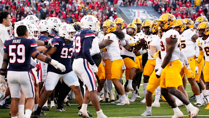 Arizona Wildcats and Arizona State Sun Devils are separated after tempers flare in the second half during the Territorial Cup game at Arizona Stadium in Tucson on Nov. 25, 2022.