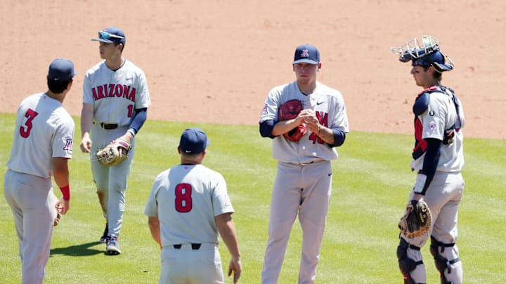 May 25, 2022; Scottsdale, Arizona, USA; Arizona Wildcats head coach Chip Hale moves pitcher Chris Barraza (46) after giving up a three-run home run to Oregon Ducks Anthony Hall in the sixth inning during the Pac-12 Baseball Tournament at Scottsdale Stadium.

Ncaa Baseball Arizona At Oregon