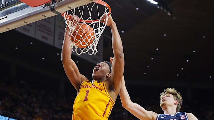 Iowa State Cyclones center Dishon Jackson (1) dunks the ball around Arizona Wildcats forward Henri Veesaar (13) during the first half in the Big-12 men’s basketball showdown at Hilton Coliseum on Saturday March 1, 2025 in Ames, Iowa.