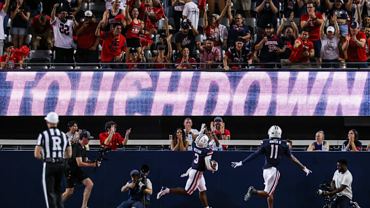 Aug 30, 2025; Tucson, Arizona, USA; Arizona Wildcats running back Kedrick Reescano (3) points up to the sky after he runs a touchdown against the Hawaii Rainbow Warriors during the first quarter of the game at Arizona Stadium. Mandatory Credit: Aryanna Frank-Imagn Images