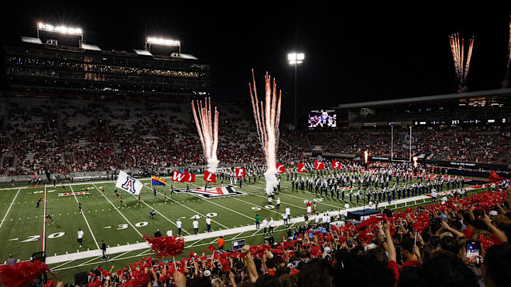 Aug 30, 2025; Tucson, Arizona, USA; Arizona Wildcats team runs out before the start of the Hawaii Rainbow Warriors at the Arizona Stadium. Mandatory Credit: Aryanna Frank-Imagn Images