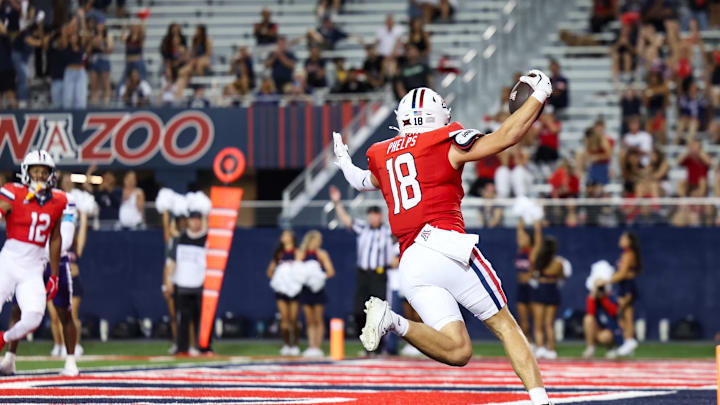 Sep 6, 2025; Tucson, Arizona, USA; Arizona Wildcats wide receiver Brandon Phelps (18) celebrates after he scores a touchdown during the second quarter of the game against the Weber State Wildcats at Arizona Stadium. Mandatory Credit: Aryanna Frank-Imagn Images