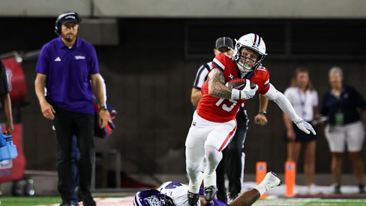 Sep 6, 2025; Tucson, Arizona, USA; Weber State Wildcats safety Tamal Johnson (31) fails to tackle Arizona Wildcats wide receiver Luke Wysong (15) during the second quarter of the game at Arizona Stadium. Mandatory Credit: Aryanna Frank-Imagn Images