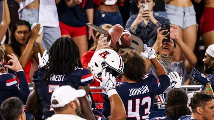Sep 12, 2025; Tucson, Arizona, USA; Arizona Wildcats defensive back Dalton Johnson (43) holds up the turnover sword during the second quarter of the game against the Kansas State Wildcats at Arizona Stadium. Mandatory Credit: Aryanna Frank-Imagn Images