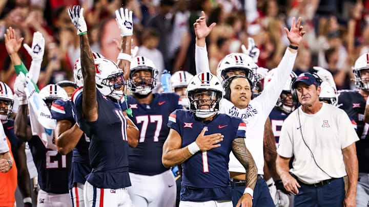 Sep 12, 2025; Tucson, Arizona, USA; Arizona Wildcats quarterback Noah Fifita (1) and teammates celebrate after the touchdown they made is confirmed by replay against the Kansas State Wildcats during the second quarter of the game at Arizona Stadium. Mandatory Credit: Aryanna Frank-Imagn Images