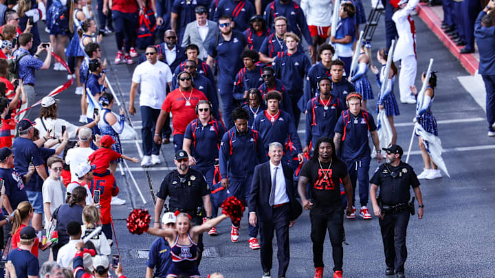 Sep 12, 2025; Tucson, Arizona, USA; Arizona Wildcats head coach Brent Brennan walks down the Wildcat Walk before the start of the game against the Kansas State Wildcats at Arizona Stadium. Mandatory Credit: Aryanna Frank-Imagn Images