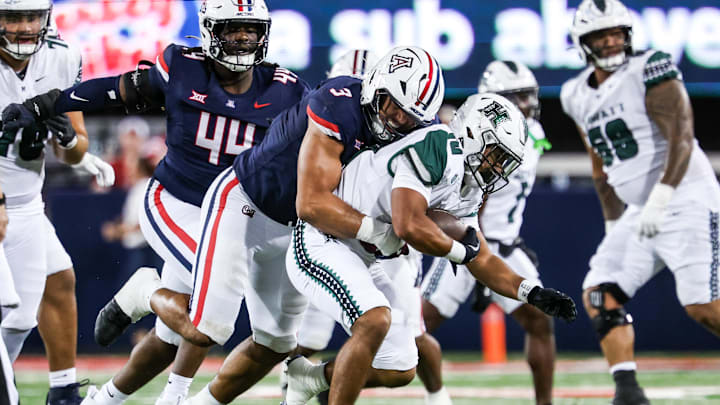 Aug 30, 2025; Tucson, Arizona, USA; Arizona Wildcats defensive lineman Tre Smith (3) tackles Hawaii Rainbow Warriors quarterback Micah Alejado (12) during the third quarter of the game at Arizona Stadium. Mandatory Credit: Aryanna Frank-Imagn Images