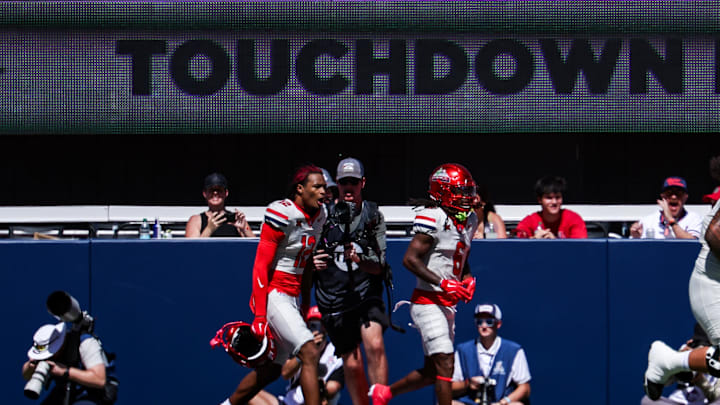 Oct 4, 2025; Tucson, Arizona, USA; Arizona Wildcats wide receivers Trey Spivey (12) (left) and Javin Whatley (6) celebrate a touchdown against the Oklahoma State Cowboys during the first quarter at Arizona Stadium. Mandatory Credit: Aryanna Frank-Imagn Images
