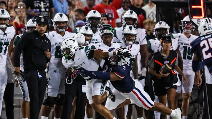 Aug 30, 2025; Tucson, Arizona, USA; Arizona Wildcats defensive lineman Tre Smith (3) tackles Hawaii Rainbow Warriors running back Cam Barfield (0) during the first quarter of the game at Arizona Stadium. Mandatory Credit: Aryanna Frank-Imagn Images