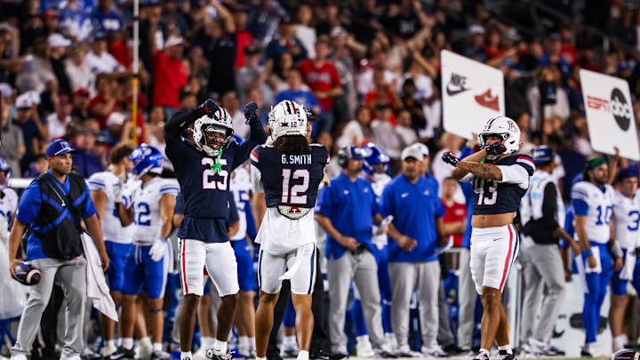 Oct 11, 2025; Tucson, Arizona, USA; Arizona Wildcats defensive backs Michael Dansby (25) and Genesis Smith (12) both celebrate during the fourth quarter of the game against the Brigham Young Cougars at Arizona Stadium. Mandatory Credit: Aryanna Frank-Imagn Images