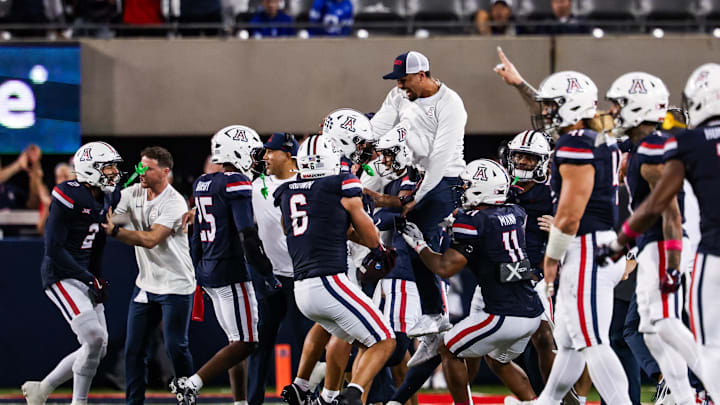 Oct 11, 2025; Tucson, Arizona, USA; Arizona Wildcats defensive back Dalton Johnson (43) celebrates an interception he caught from the Brigham Young Cougars with his team during the third quarter of the game at Arizona Stadium. Mandatory Credit: Aryanna Frank-Imagn Images Oct 11, 2025; Tucson, Arizona, USA; Arizona Wildcats defensive back Dalton Johnson (43) celebrates an interception he caught from the Brigham Young Cougars with his team during the third quarter of the game at Arizona Stadium. Mandatory Credit: Aryanna Frank-Imagn Images