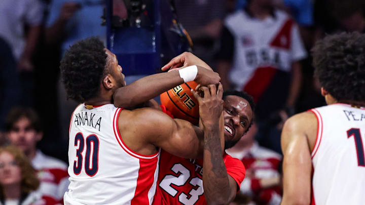 Nov 7, 2025; Tucson, Arizona, USA; Arizona Wildcats forward Tobe Awaka (30) attempts to take the ball from Utah Tech Trailblazers Samuel “Tobi” Ariyibi (23) during the first half of the game at McKale Memorial Center. Mandatory Credit: Aryanna Frank-Imagn Images
