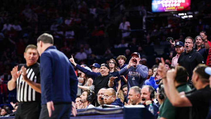 Dec 22, 2025; Tucson, Arizona, USA; Arizona Wildcats fans yells towards the referee after a technical foul was called during the second half of the game against the Bethune-Cookman Wildcats at McKale Memorial Center. Mandatory Credit: Aryanna Frank-Imagn Images Dec 22, 2025; Tucson, Arizona, USA; Arizona Wildcats fans yells towards the referee after a technical foul was called during the second half of the game against the Bethune-Cookman Wildcats at McKale Memorial Center. Mandatory Credit: Aryanna Frank-Imagn Images