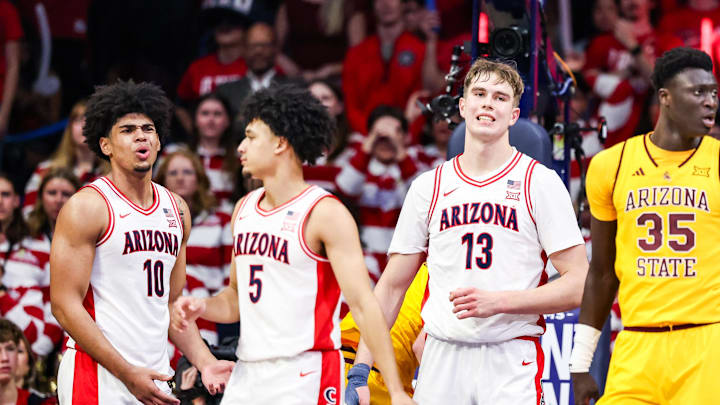 Jan 14, 2026; Tucson, Arizona, USA; Arizona Wildcats forward Koa Peat (10) and center Motiejus Krivas (13) react to a foul during the second half of the game against the Arizona State Sun Devils at McKale Memorial Center. Mandatory Credit: Aryanna Frank-Imagn Images