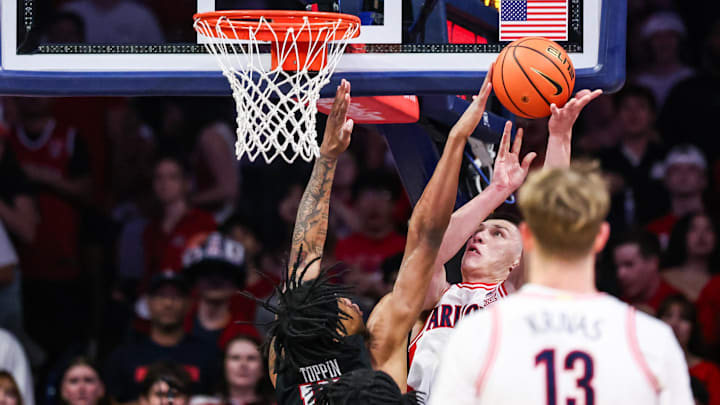 Feb 14, 2026; Tucson, Arizona, USA; Texas Tech Red Raiders forward JT Toppin (15) blocks a layup attempt by Arizona Wildcats forward Ivan Kharchenkov (8) during the first half of the game at McKale Memorial Center. Mandatory Credit: Aryanna Frank-Imagn Images