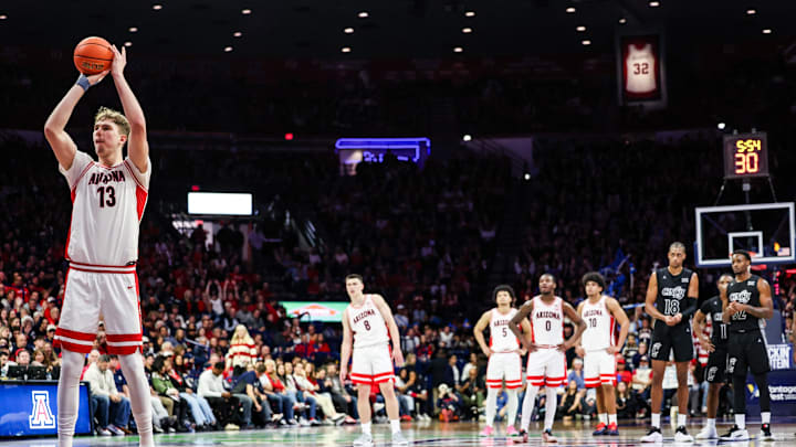 Jan 21, 2026; Tucson, Arizona, USA; Arizona Wildcats center Motiejus Krivas (13) shoots a technical free throw during the second half of the game against the Cincinnati Bearcats at McKale Memorial Center. Mandatory Credit: Aryanna Frank-Imagn Images