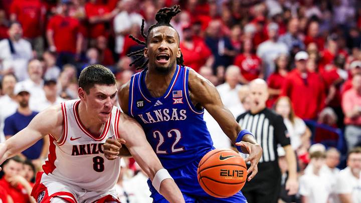 Feb 28, 2026; Tucson, Arizona, USA; Arizona Wildcats forward Ivan Kharchenkov (8) fouls Kansas Jayhawks guard Darryn Peterson (22) during the first half of the game at McKale Memorial Center. Mandatory Credit: Aryanna Frank-Imagn Images