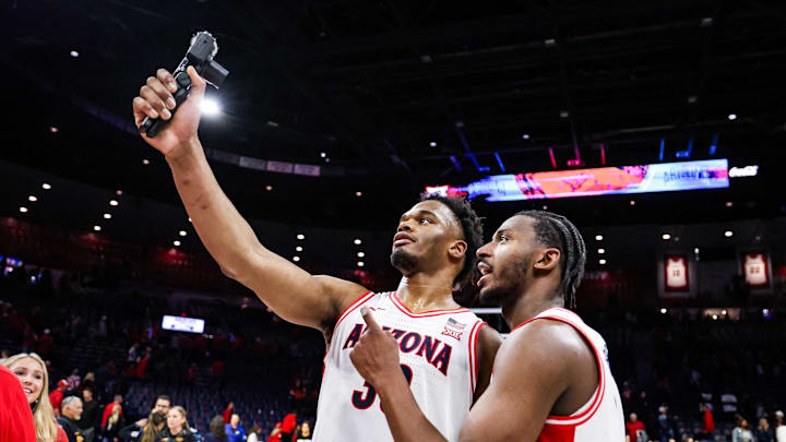 Jan 14, 2026; Tucson, Arizona, USA; Arizona Wildcats forward Tobe Awaka (30) and guard Jaden Bradley (0) celebrate a win against the Arizona State Sun Devils at the end of the game at McKale Memorial Center. Mandatory Credit: Aryanna Frank-Imagn Images Jan 14, 2026; Tucson, Arizona, USA; Arizona Wildcats forward Tobe Awaka (30) and guard Jaden Bradley (0) celebrate a win against the Arizona State Sun Devils at the end of the game at McKale Memorial Center. Mandatory Credit: Aryanna Frank-Imagn Images