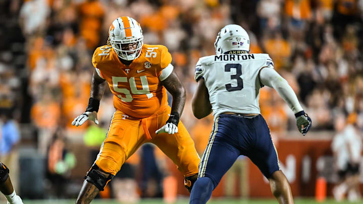 Sep 17, 2022; Knoxville, Tennessee, USA; Tennessee Volunteers offensive lineman Gerald Mincey (54) blocks Akron Zips wide receiver Daniel George (3) during the first half at Neyland Stadium. Mandatory Credit: Bryan Lynn-USA TODAY Sports