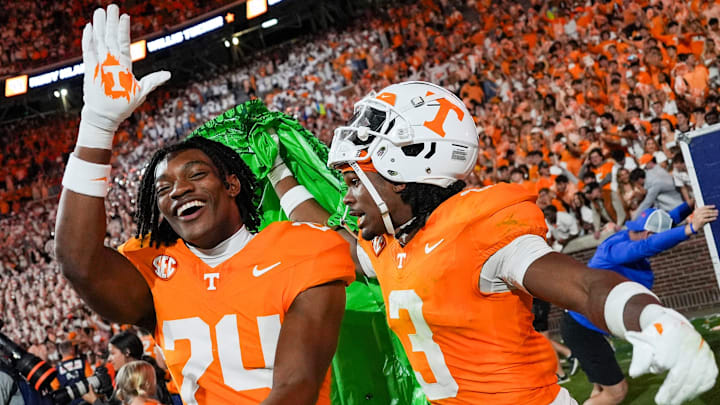 Oct 12, 2024; Knoxville, Tennessee, USA; Tennessee Volunteers defensive back Jordan Matthews (24) gator chomps as defensive back Jermod McCoy (3) carries a deflated inflatable alligator after a game against the  Florida Gators at Neyland Stadium. Mandatory Credit: Brianna Paciorka/USA TODAY Network via Imagn Images