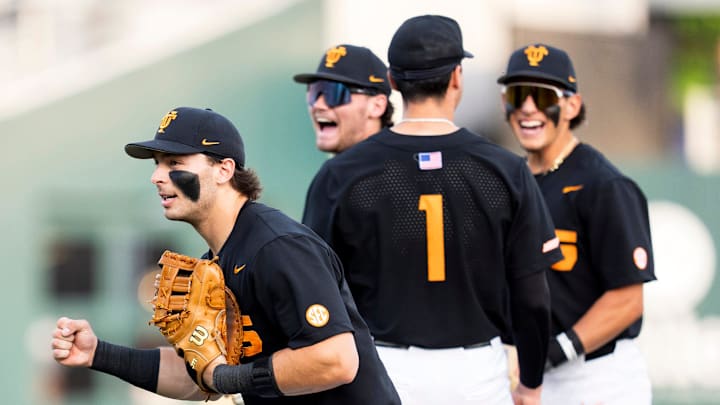 Tennessee infielders celebrate an umpire review that led to a double play during a college baseball game between Tennessee and Vanderbilt at Lindsey Nelson Stadium in Knoxville, Tenn., on May 9, 2025.