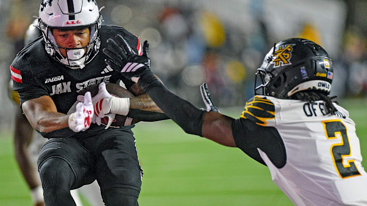 Jax State's Cam Cook scores a touchdown as Kennesaw State's Caleb Offord defends during the C-USA Championship at AmFirst Stadium in Jacksonville, Alabama December 5, 2025. (Dave Hyatt / Hyatt Media LLC)