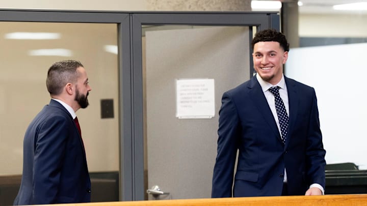 Tennessee quarterback Joey Aguilar, right, and Cam Norris, attorney for Aguilar, before a hearing in Knox County Chancery Court in Knoxville, Tennessee., on Feb. 13, 2026.