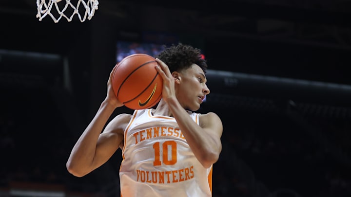 Feb 18, 2026; Knoxville, Tennessee, USA;  Tennessee Volunteers forward Nate Ament (10) rebounds the ball against the Oklahoma Sooners during the second half at Thompson-Boling Arena at Food City Center. Mandatory Credit: Randy Sartin-Imagn Images