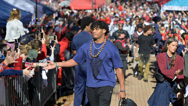 Ole Miss Rebels quarterback Austin Simmons (13) gives high fives on the Walk of Champions before the Ole Miss vs. Tulane College Football Playoff game in Oxford, Miss. on Saturday, December 20, 2025.