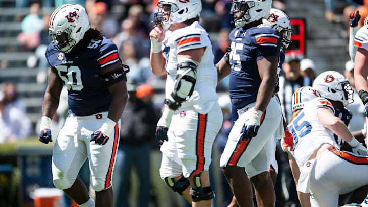Auburn Tigers defensive lineman Marcus Harris (50) celebrates after making a stop in the backfield during the A-Day spring practice at Jordan-Hare Stadium in Auburn, Ala., on Saturday, April 9, 2022.