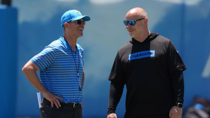 Jun 16, 2025; El Segundo, CA, USA; Los Angeles Chargers coach Jim Harbaugh (left) and executive director of player performance Ben Herbert during organized team activities at The Bolt. Mandatory Credit: Kirby Lee-Imagn Images