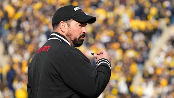 Nov 25, 2023; Ann Arbor, Michigan, USA; Ohio State Buckeyes head coach Ryan Day leads his team in