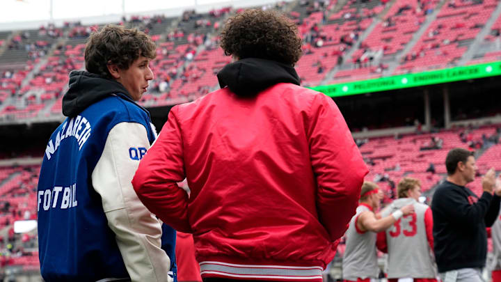 Nazareth Academy quarterback Peyton Falzone talks to Bellefontaine quarterback Tavien St. Clair prior to the NCAA football game against the Indiana Hoosiers at Ohio Stadium in Columbus on Saturday, Nov. 23, 2024.