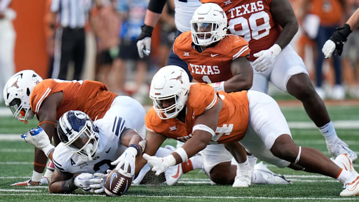 Texas Longhorns defensive lineman Jaray Bledsoe recovers a BYU Cougars fumble in the fourth quarter at Royal-Memorial Stadium on Saturday October 28, 2023.