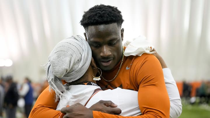 Ryan Watts hugs his mother Claire Watts-Cooper at Texas Longhorns Football Pro Day at Frank Denius Fields Wednesday March 20, 2024.