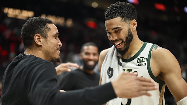 Mar 11, 2024; Portland, Oregon, USA; Boston Celtics forward Jayson Tatum (0) embraces former teammate Portland Trail Blazers guard Malcolm Brogdon (11) after a game at Moda Center. Mandatory Credit: Troy Wayrynen-Imagn Images