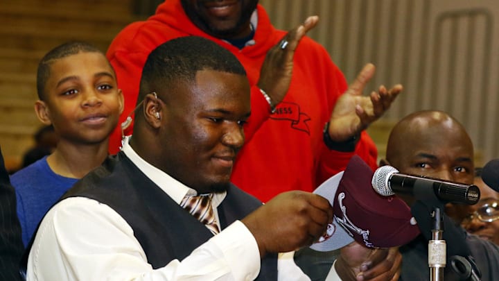 Feb 4, 2015; Gladewater, TX, USA; Daylon Mack dons a Texas A&M hat announcing that he is signing