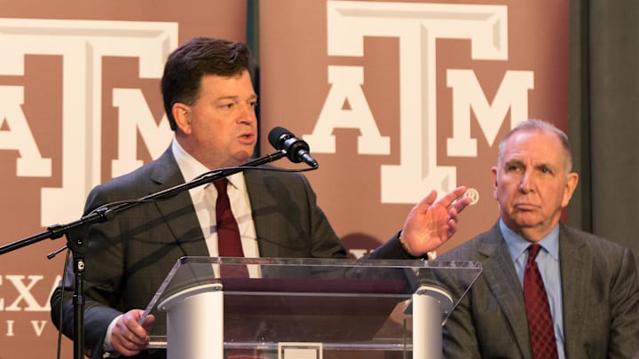 Dec 4, 2017; College Station, TX, USA; Texas A&M president Michael Young looks on as athletic director Scott Woodward speaks during Jimbo Fisher's introductory press conference held Monday morning at the Hall of Champions in Kyle Field. Mandatory Credit: C. Morgan Engel-Imagn Images