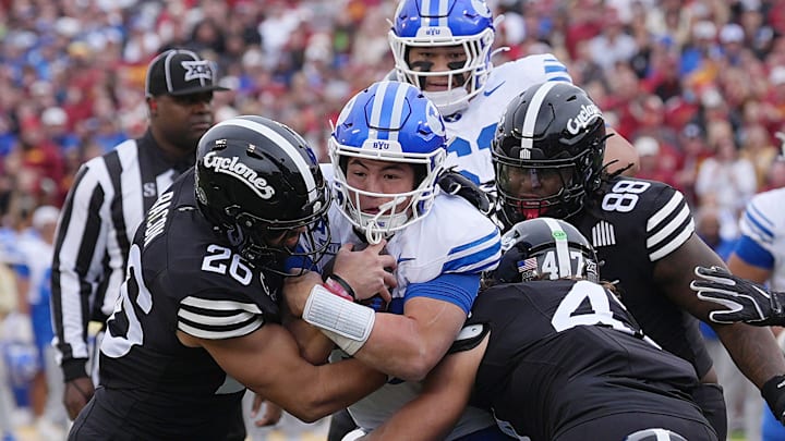 Iowa State Cyclones' linebacker Caleb Bacon (26) and linebacker Kooper Ebel (47) takes down BYU Cougars quarterback Bear Bachmeier (47) during the first quarter at Jack Trice Stadium on Oct. 25, 2025, in Ames, Iowa. Iowa State Cyclones' linebacker Caleb Bacon (26) and linebacker Kooper Ebel (47) takes down BYU Cougars quarterback Bear Bachmeier (47) during the first quarter at Jack Trice Stadium on Oct. 25, 2025, in Ames, Iowa.