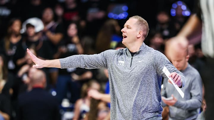 Feb 18, 2026; Tucson, Arizona, USA; Brigham Young Cougars head coach Kevin Young yells out to players during the first half of the game against the Arizona Wildcats at McKale Memorial Center. Mandatory Credit: Aryanna Frank-Imagn Images