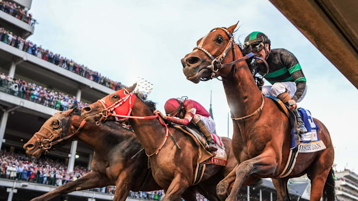 May 4, 2024; Louisville, KY, USA; Mystik Dan (right) wins the Kentucky Derby in a photo finish