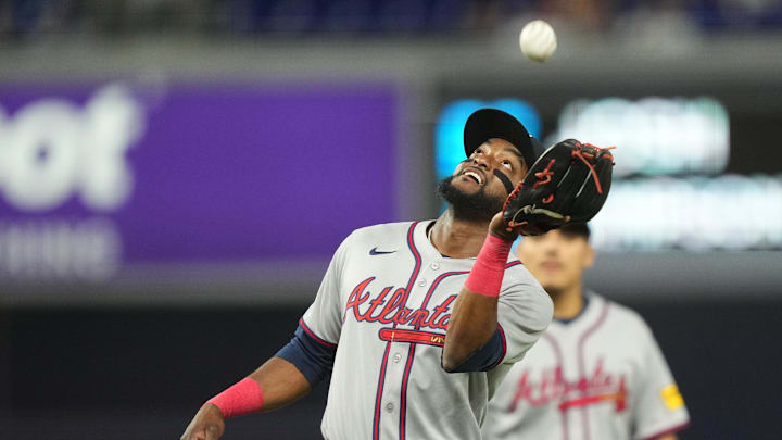 Aug 25, 2025; Miami, Florida, USA;  Atlanta Braves third baseman Vidal Brujan (17) catches an infield pop-fly against the Miami Marlins to end the eighth inning at loanDepot Park. Mandatory Credit: Jim Rassol-Imagn Images