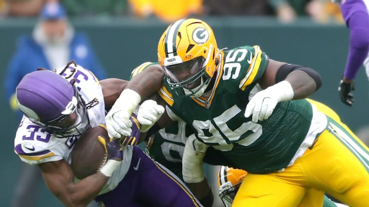 Green Bay Packers defensive tackle Devonte Wyatt (95) tackles Minnesota Vikings running back Aaron Jones Sr. (33) on Sunday, November 23, 2025, at Lambeau Field in Green Bay, Wis. The Packers defeated the Vikings 23-6.
Wm. Glasheen USA TODAY NETWORK-Wisconsin