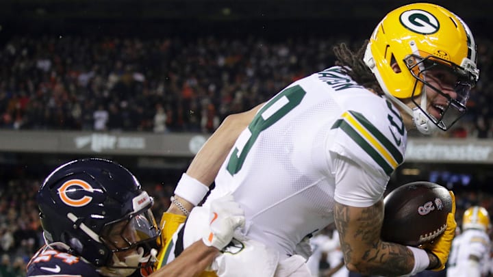 Green Bay Packers wide receiver Christian Watson (9) crosses the goal line on a first quarter pass reception against Chicago Bears cornerback Nick McCloud (24) during their wild-card playoff football game Saturday, January 10, 2026, at Soldier Field in Chicago, Illinois. 
Wm. Glasheen /USA TODAY NETWORK-Wisconsin.