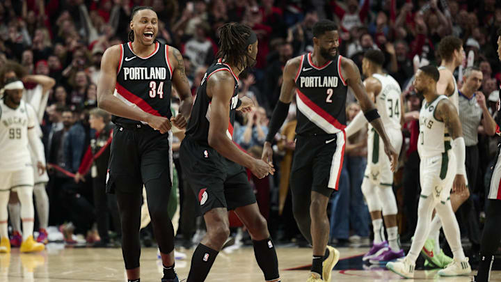 Jan 31, 2024; Portland, Oregon, USA; Portland Trail Blazers forward Jabari Walker (34) celebrates with forward Jerami Grant (9) after beating the Milwaukee Bucks at Moda Center. Mandatory Credit: Troy Wayrynen-USA TODAY Sports