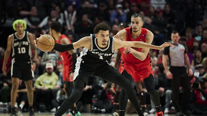Dec 13, 2024; Portland, Oregon, USA; San Antonio Spurs center Victor Wembanyama (1) dribbles the basketball during the second half against Portland Trail Blazers forward Toumani Camara (33) at Moda Center. Mandatory Credit: Troy Wayrynen-Imagn Images